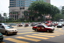 Busy crossing at KL city center Busy crossing at KL city center