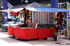 Street vendor in sunglasses Street vendor in sunglasses