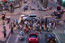Crowd at a crossing in busy Kuala Lumpur